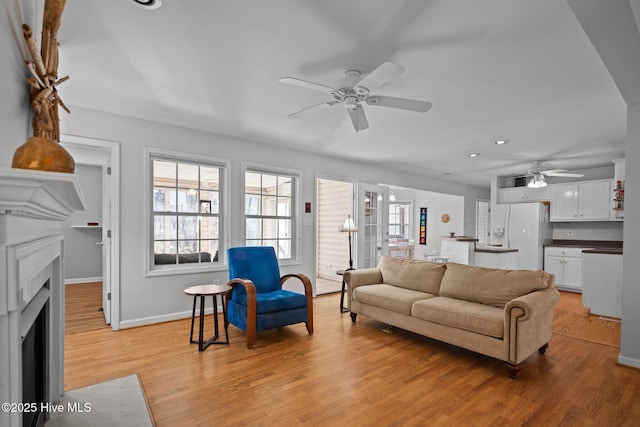 110 SE 7th St, Oak Island, NC 28465 - living room with a ceiling fan, plenty of natural light, light wood finished floors, baseboards, and recessed lighting