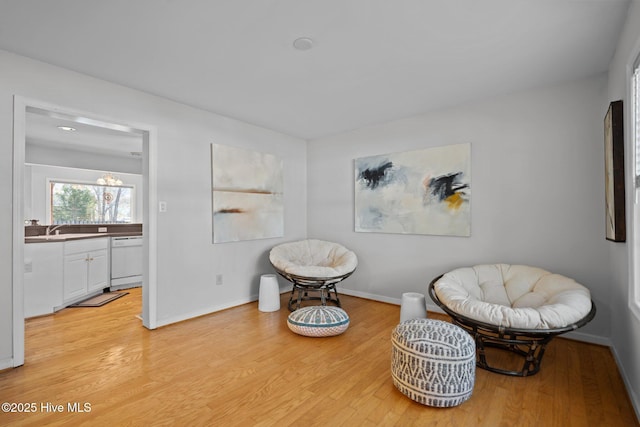 110 SE 7th St, Oak Island, NC 28465 - living area with light wood-style floors and baseboards