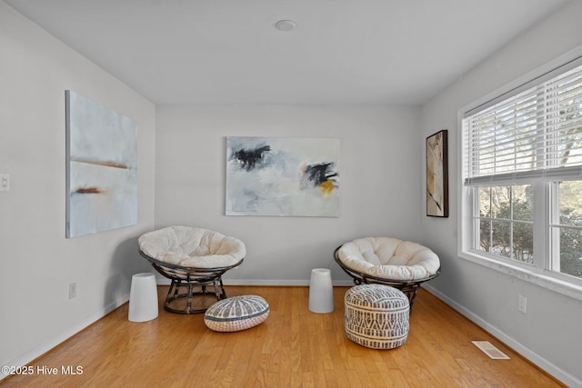 110 SE 7th St, Oak Island, NC 28465 - living area with wood finished floors and baseboards