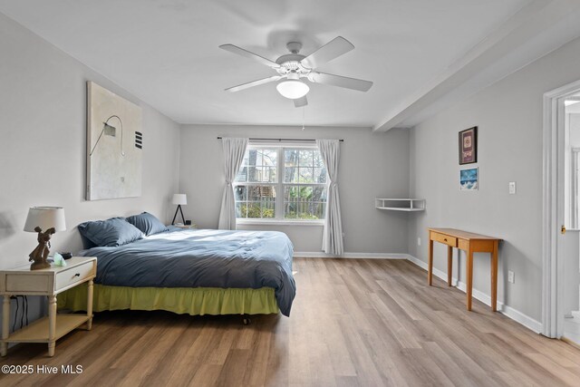 110 SE 7th St, Oak Island, NC 28465 - bedroom featuring light wood-style floors, baseboards, and a ceiling fan