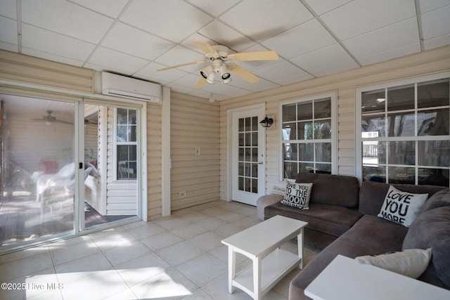 110 SE 7th St, Oak Island, NC 28465 - sunroom / solarium featuring a wall mounted air conditioner, a ceiling fan, and outdoor lounge area