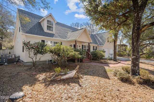 110 SE 7th St, Oak Island, NC 28465 - cape cod house with a shingled roof and central AC