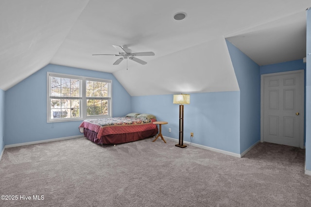 110 SE 7th St, Oak Island, NC 28465 - bedroom with carpet floors, lofted ceiling, baseboards, and a ceiling fan