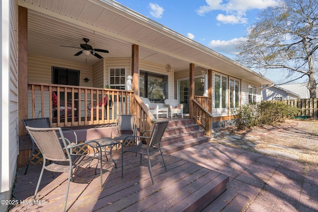 110 SE 7th St, Oak Island, NC 28465 - deck featuring a ceiling fan and fence