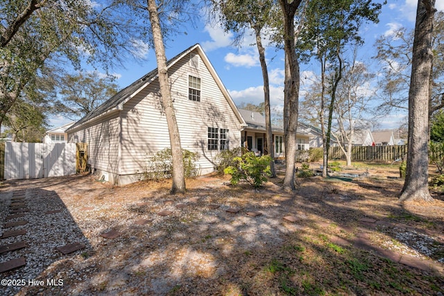 110 SE 7th St, Oak Island, NC 28465 - view of side of property with fence