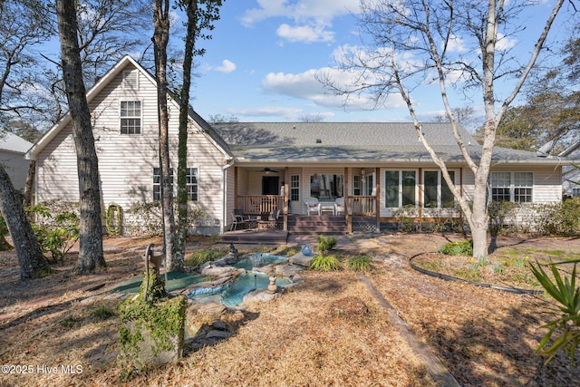 110 SE 7th St, Oak Island, NC 28465 - rear view of house with ceiling fan and covered porch