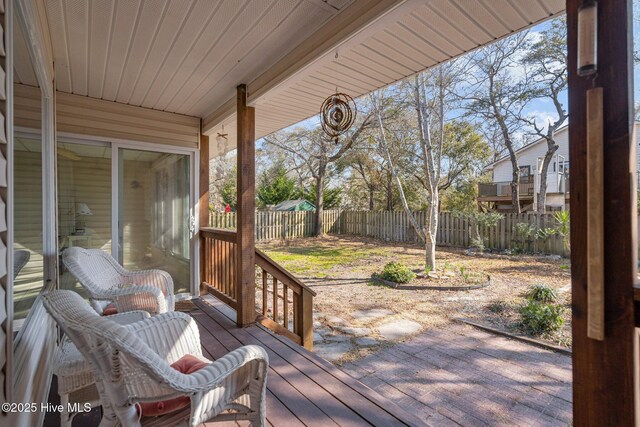 110 SE 7th St, Oak Island, NC 28465 - deck with a fenced backyard and a patio area