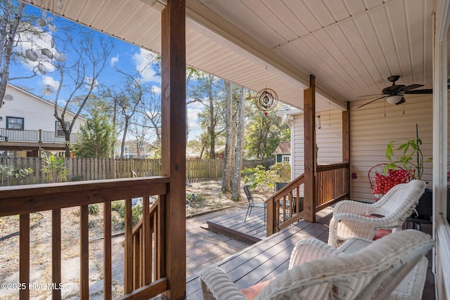 110 SE 7th St, Oak Island, NC 28465 - wooden terrace with a fenced backyard and ceiling fan