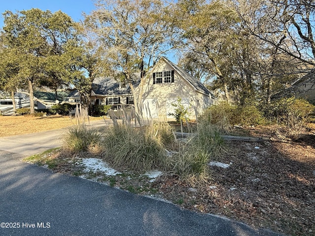 110 SE 7th St, Oak Island, NC 28465 - view of home's exterior with driveway