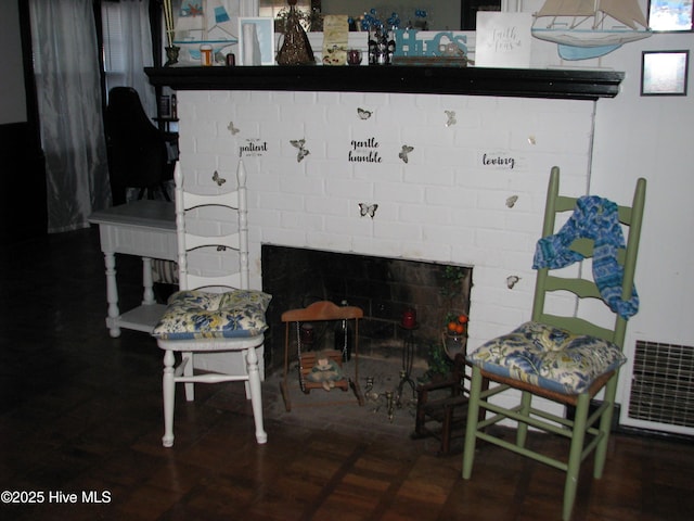 interior space with a brick fireplace