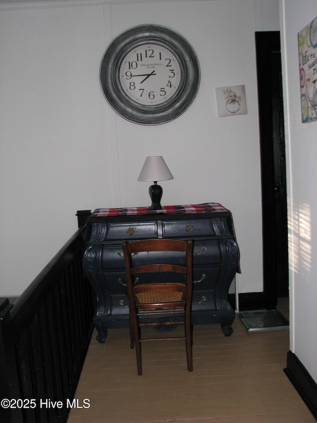 dining room with baseboards and wood finished floors