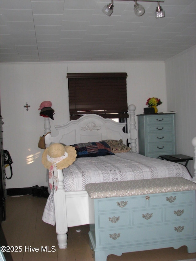 bedroom with wood finished floors