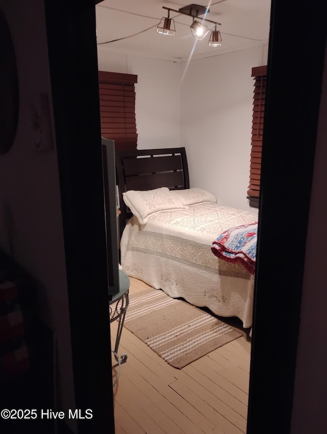 bedroom with wood finished floors