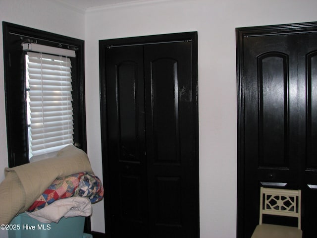 bedroom with ornamental molding