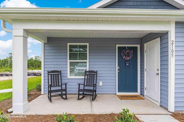 property entrance with covered porch