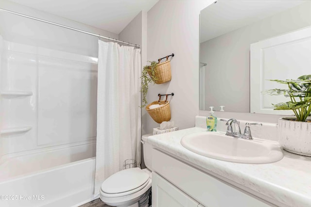 bathroom featuring shower / tub combo, vanity, and toilet