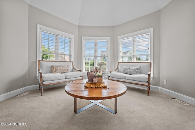 living room featuring baseboards, visible vents, and carpet flooring