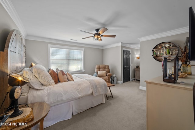 bedroom featuring crown molding, baseboards, visible vents, and light colored carpet