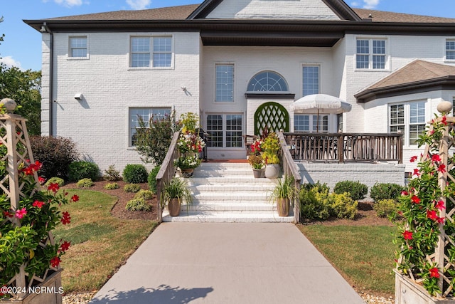 view of front of property featuring brick siding