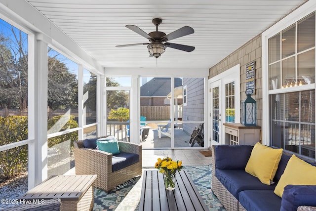 sunroom / solarium with ceiling fan