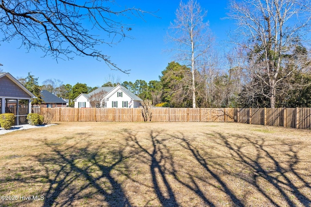 view of yard with a fenced backyard