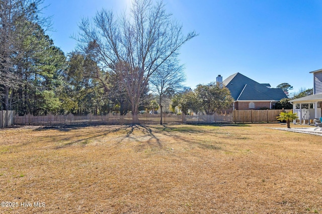 view of yard featuring a patio area and fence