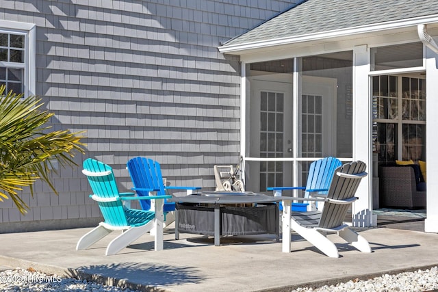 view of patio / terrace featuring a sunroom