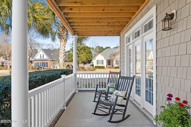 balcony featuring a residential view and a porch