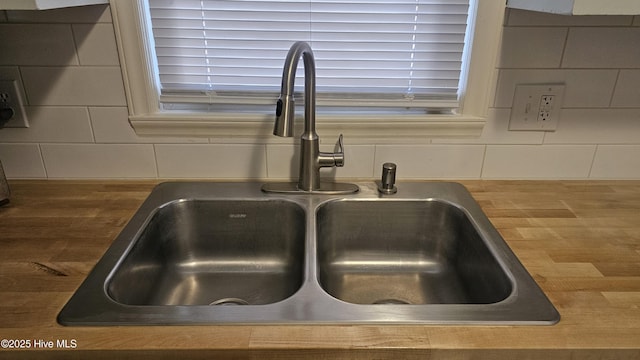 details featuring concrete block wall and a sink