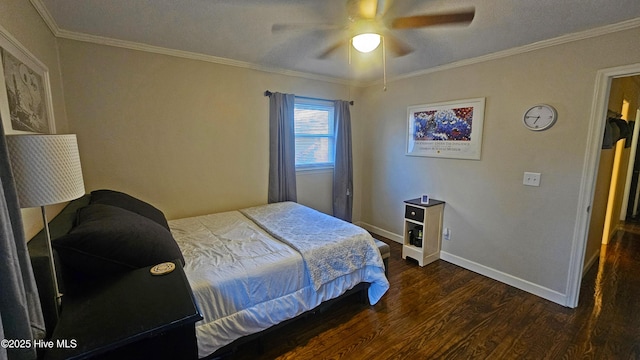 bedroom with baseboards, a ceiling fan, wood finished floors, and crown molding