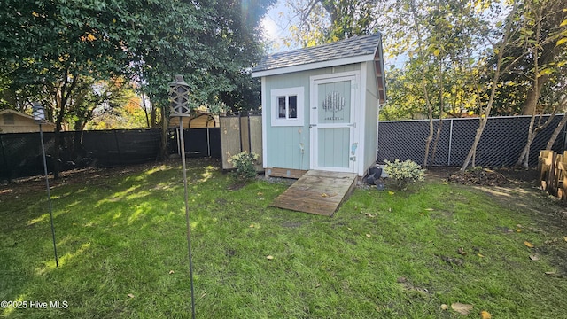 view of shed with a fenced backyard