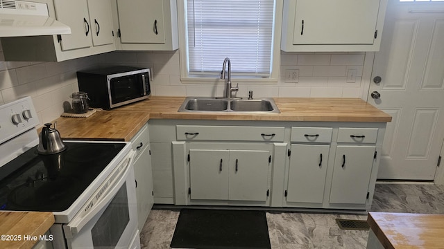 kitchen with white electric range oven, wooden counters, under cabinet range hood, and a sink