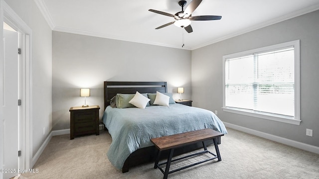 bedroom featuring ornamental molding, light colored carpet, ceiling fan, and baseboards