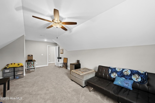 living area featuring carpet, vaulted ceiling, baseboards, and ceiling fan