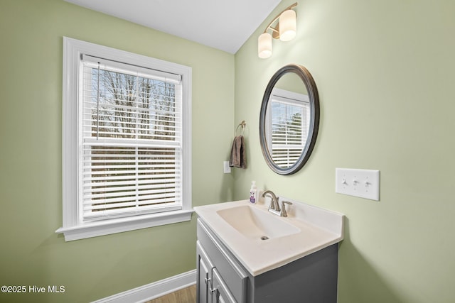 bathroom featuring vanity and baseboards