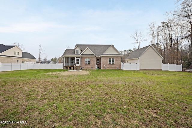 view of front of home with a front lawn, crawl space, a fenced backyard, and a sunroom