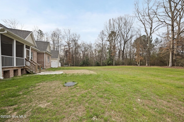 view of yard with a sunroom