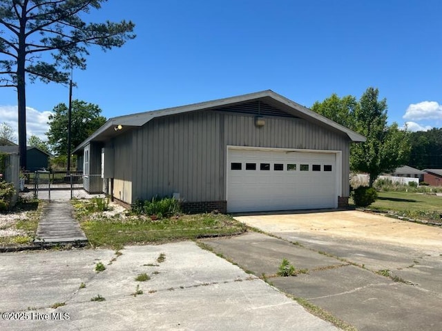view of side of home with a garage