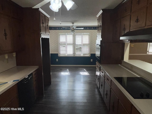 kitchen featuring black electric cooktop, under cabinet range hood, a ceiling fan, light countertops, and wallpapered walls