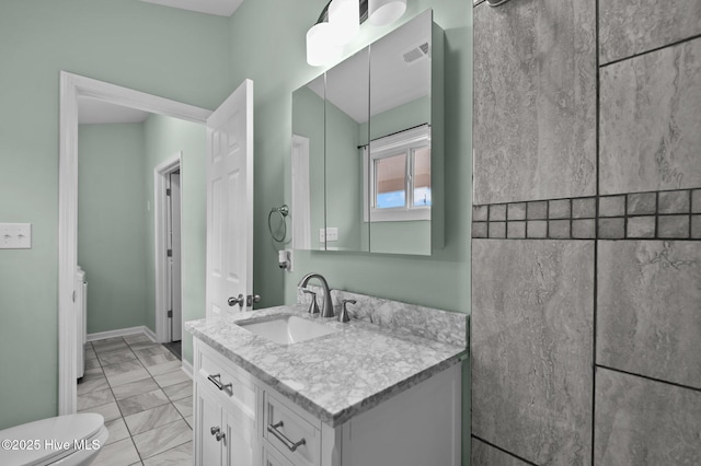 bathroom with visible vents, baseboards, toilet, marble finish floor, and vanity