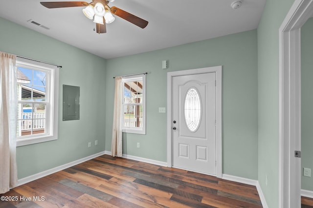 entrance foyer with electric panel, visible vents, baseboards, and wood finished floors