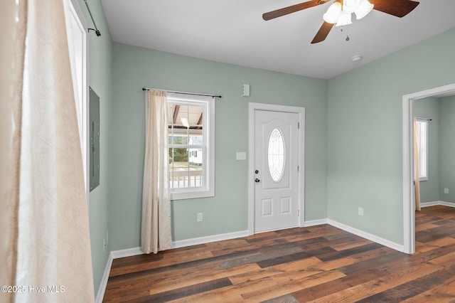 entryway featuring a ceiling fan, baseboards, and wood finished floors