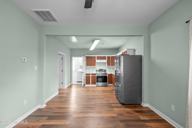 kitchen with visible vents, baseboards, dark wood-type flooring, light countertops, and appliances with stainless steel finishes