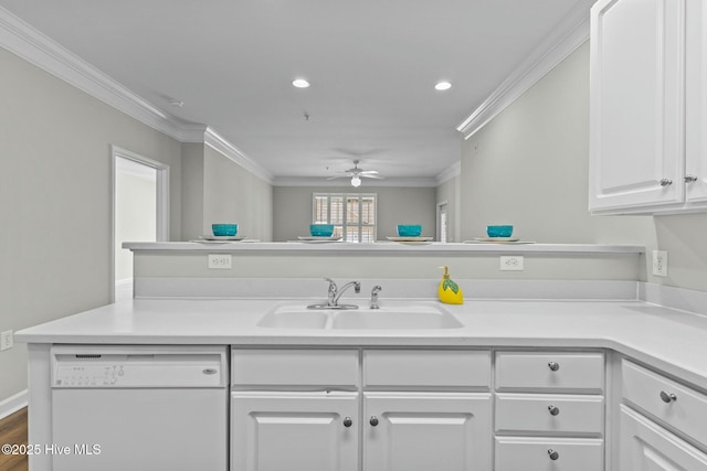 kitchen with ornamental molding, light countertops, dishwasher, and a sink