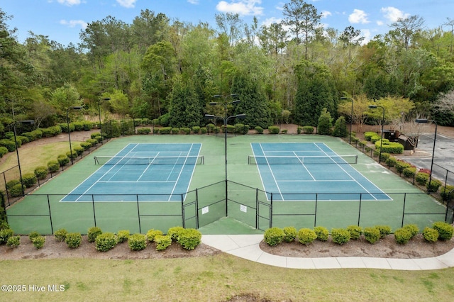 view of sport court with fence