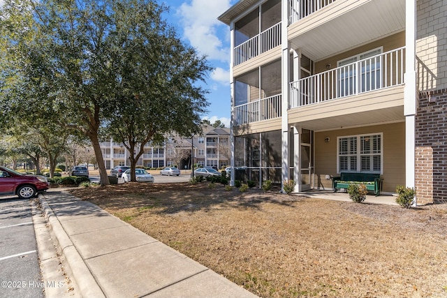 view of property with uncovered parking