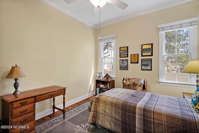 bedroom featuring crown molding, multiple windows, baseboards, and dark wood-type flooring