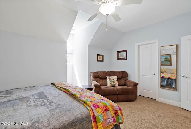 bedroom featuring carpet floors, vaulted ceiling, and ceiling fan