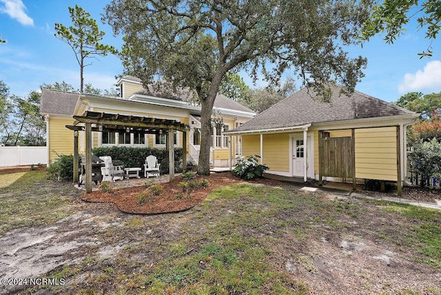 back of house with fence and a patio