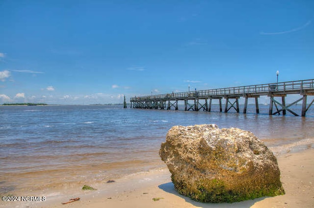 dock area with a water view and a pier